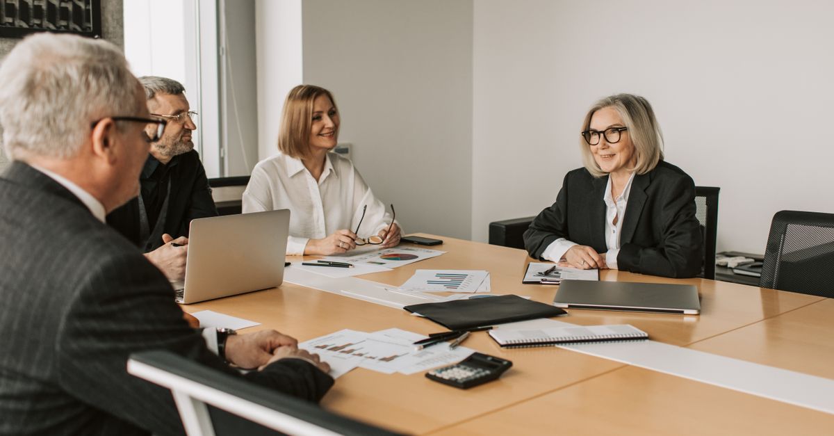 Diverse group of professionals engaged in an office strategy meeting.