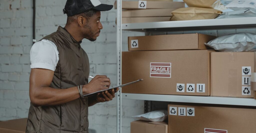 Courier checking packages in a warehouse, ensuring fragile handling