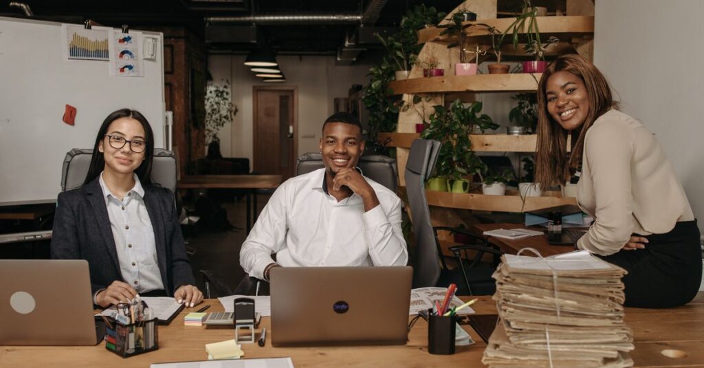 A diverse team of business professionals working together in a modern office setting.