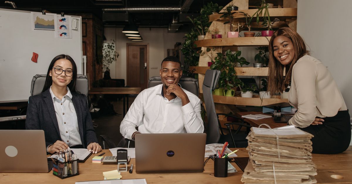 A diverse team of business professionals working together in a modern office setting.