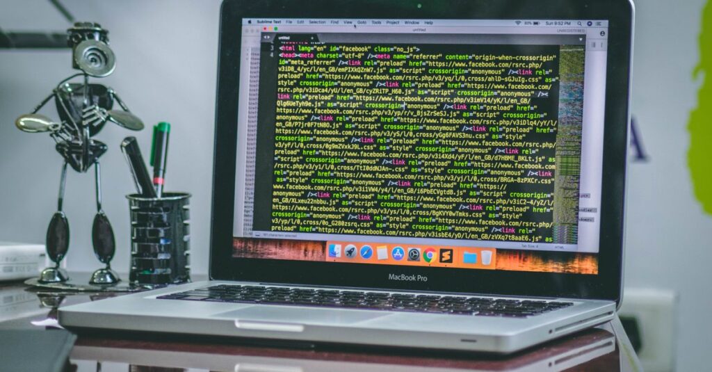 A sleek MacBook Pro displaying code on a desk with office tools and creative decorations.