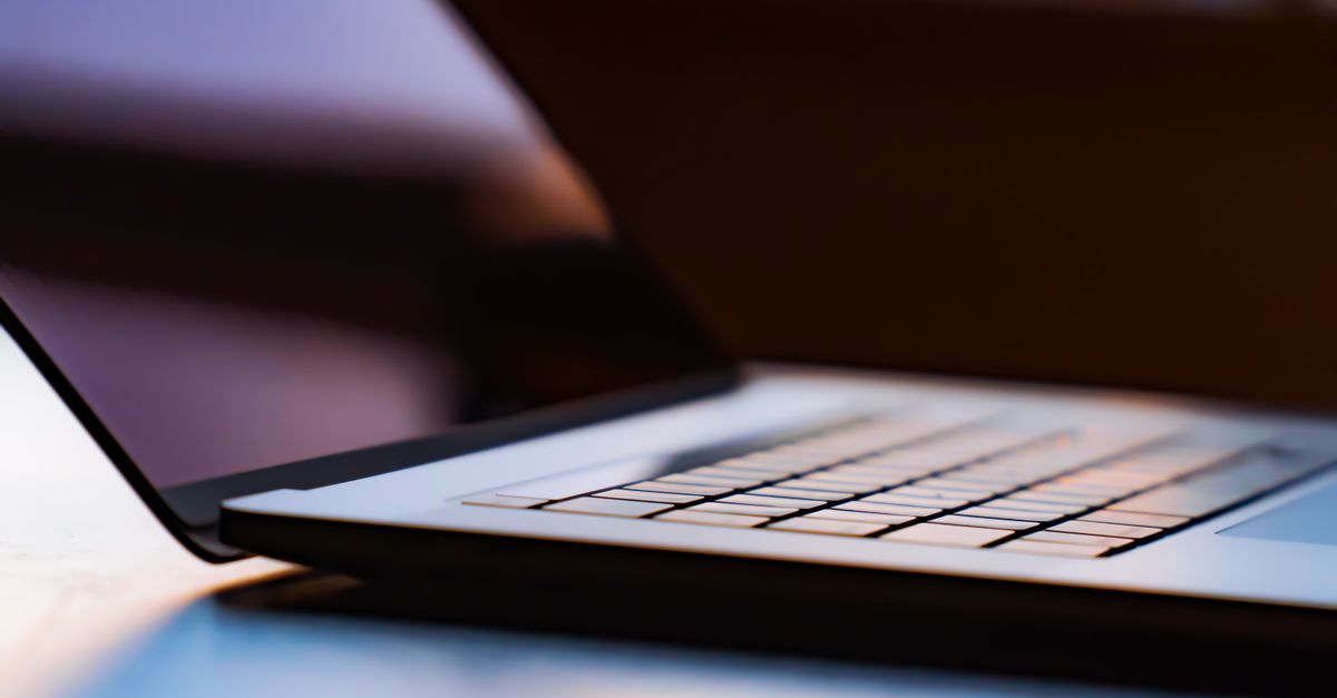 A detailed view of a laptop keyboard with shallow depth of field.