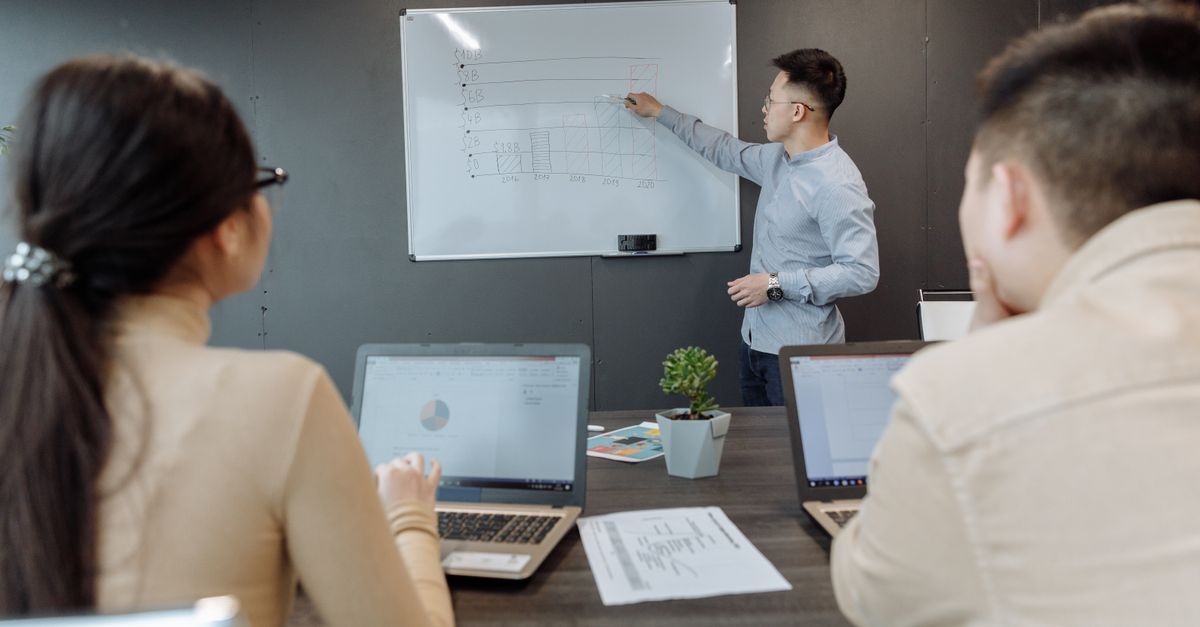 Business team discussing project strategy during a meeting in a modern office.