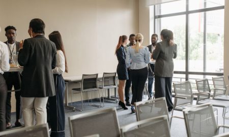 Professionals engaging in a casual networking session during a business conference.