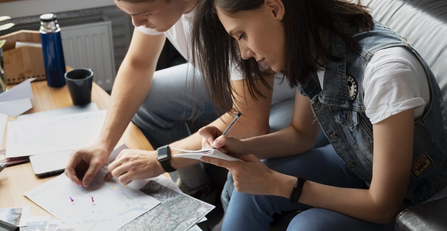 close-up-man-woman-planning-trip