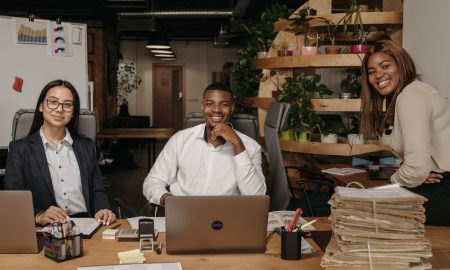A diverse team of business professionals working together in a modern office setting.