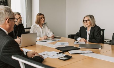 Diverse group of professionals engaged in an office strategy meeting.