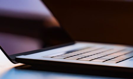 A detailed view of a laptop keyboard with shallow depth of field.