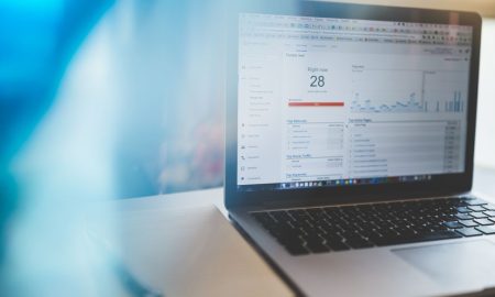 Laptop displaying Google Analytics in a modern workspace, highlighting digital analytics and technology.